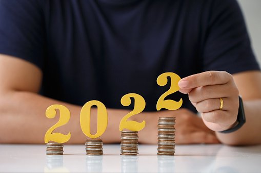 Man hands putting gold wooden number